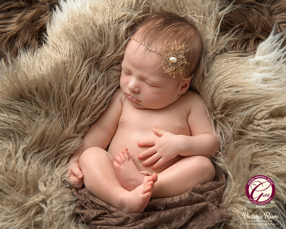 Award-winning image of newborn baby girl just 11 days old captured at Isleworth photographer's studio in South West London